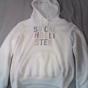 Hollister jacket, white with grey and tan writing
